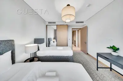 a hotel room with a bed and a desk at Vida Residences Dubai Mall - Burj Khalifa View, Downtown Dubai in Dubai