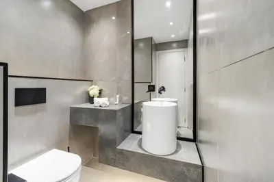 a bathroom with a toilet and a sink at 2BR Marina View Steps from the Beach in Dubai