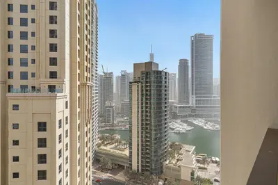 an aerial view of a city with tall buildings at 2BR Marina View Steps from the Beach in Dubai