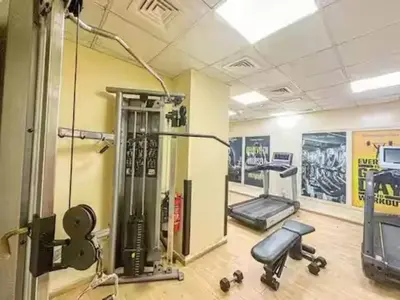 a gym with cardio equipment in a room at Luxury 2BR in Dubai Marina Man 1105 in Dubai