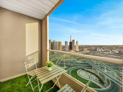 a balcony with a bench and a view of a city at Luxury 3BHK w Floating Bed in Dubai Marina Man 2501 in Dubai