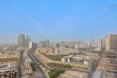 an aerial view of a city with tall buildings at Stylish Comfort Studio in Westwood Grande in Dubai
