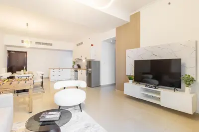 a living room with a large television and a table at 3BHK and Floating Bed in Dubai Marina w View DEC 1707 in Dubai