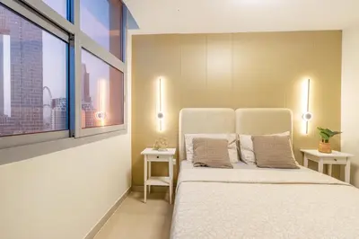 a bedroom with a bed and a large window at 3BHK and Floating Bed in Dubai Marina w View DEC 1707 in Dubai