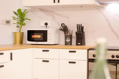 a kitchen with a microwave on a counter at 3BHK and Floating Bed in Dubai Marina w View DEC 1707 in Dubai