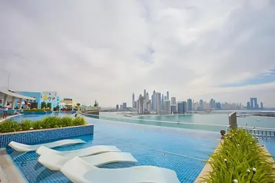 a swimming pool with a view of the city at Comfortable apartments on the Palm in Dubai