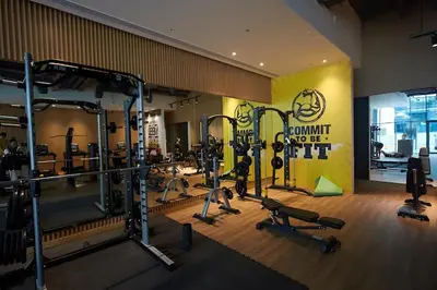a gym with treadmills and weights in a room at Comfortable apartments on the Palm in Dubai