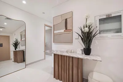 a bathroom with a counter with flowers on it at Luxury 3 Bedroom Apartment in Creek Harbour in Dubai
