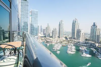 a view of a harbor with boats in the water at Elegant 1-BDR with Panoramic Marina & Canal Views in Dubai