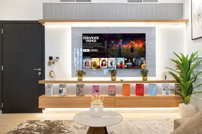a living room with a fireplace with a tv on it at Luxury 5BR Marina View w Private Pool KG1004 in Dubai