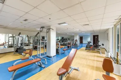 a gym with several treadmills and exercise bikes at Luxury 5BR Marina View w Private Pool KG1004 in Dubai