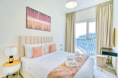 a bedroom with a bed and a large window at PVH - Posh 2BR with 1 Queen Bed Plus 1 Single Bed - Collective 2-0 in Dubai