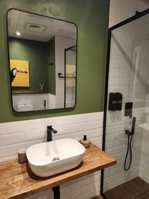a bathroom with a white sink and a mirror at Modern 1BR Apartment - Marina Walk in Dubai