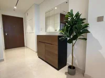 a kitchen with a counter and a potted plant at Coastal Chic at Emaar Beachfront 1BR in Dubai