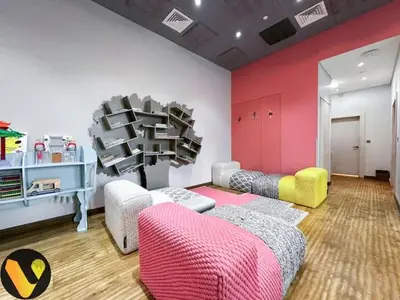 a living room with two couches and a pink wall at Vogue Downtown Emaar Residence Fashion Avenue with Direct Access to Dubai Mall, Studio Apartment with Balcony Overlooking Burj Khalifa View, Access to all Amenitties in Dubai