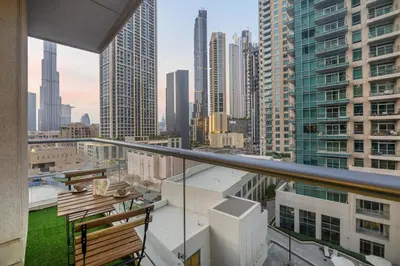 a balcony with a view of a city at Luxury 2BR in Downtown w Iconic Burj Khalifa View Burj Views 303 in Dubai
