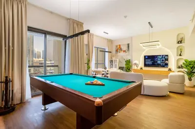 a living room with a pool table at Luxurious 3BHK w Marina Views & Pool Table by dPie Sadaf 408 in Dubai