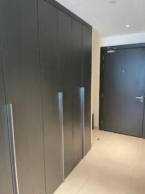 a hallway with a large door in a building at Convenient studio in the centre of Dubai in Dubai