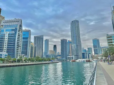 a river in a city with tall buildings at Premium Ensuite Room With Balcony in Dubai