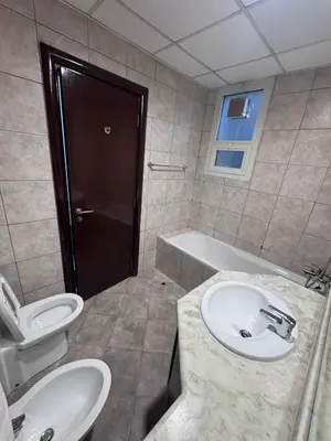 a bathroom with a sink and a toilet and a tub at Premium Ensuite Room With Balcony in Dubai