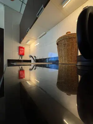 a room with a basket and a paddle on a wall at Modern Studio Apartment in Dubai Sports City in Dubai