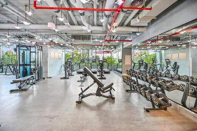 a gym with a lot of treadmills and machines at Downtown Dubai, Canal view ,Mag318 in Dubai