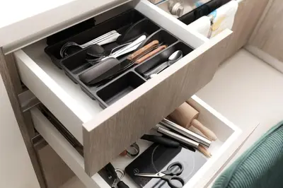 a drawer filled with utensils in a cabinet at BRAND NEW FULL MARINA VIEW 1BR Apartment at LIV Marina in Dubai