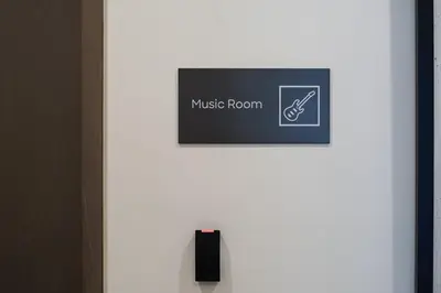 a white door with a music room sign on it at BRAND NEW FULL MARINA VIEW 1BR Apartment at LIV Marina in Dubai