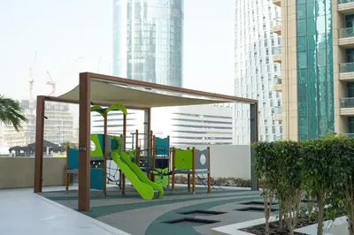 a playground with a slide in a city at BRAND NEW FULL MARINA VIEW 1BR Apartment at LIV Marina in Dubai