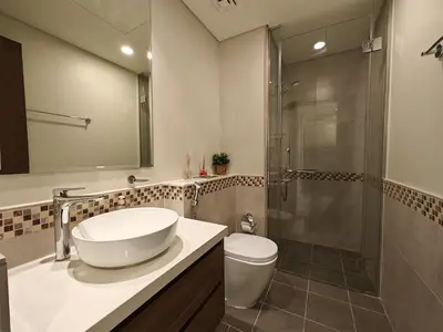 a bathroom with a sink and a shower at Centrally Located 1 BR in Damac Reva - 7 Min walk to Dubai Mall in Dubai