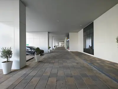 a hallway of a building with a car parked at Centrally Located 1 BR in Damac Reva - 7 Min walk to Dubai Mall in Dubai