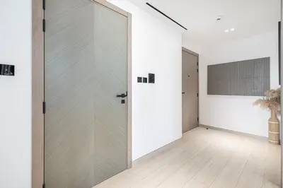 an empty hallway with a sliding glass door at 1BR Luxury Stay With Pool, Gym and Skyline View in Dubai