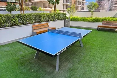 a blue ping pong table on a roof at Estudio Noor en Dubai Por beBalmy in Dubai