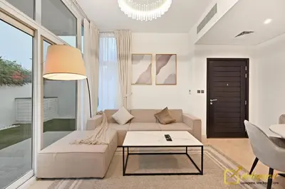 a living room with a couch and a table at Luxurious 3BR Villa Getaway in DH2 by Deleguest in Dubai