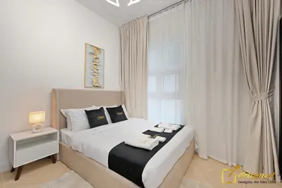 a bedroom with a large bed with a window at Luxurious 3BR Villa Getaway in DH2 by Deleguest in Dubai