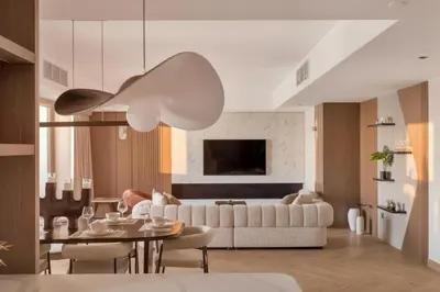 a living room with a white couch and a table at Luxury 4 Bedroom Penthouse in Dubai Marina in Dubai