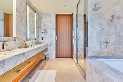 a bathroom with two sinks and a tub and a shower at Premium 5 bedroom penthouse opposite Burj Khalifa in Dubai