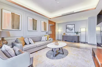 a living room with a couch and a table at Premium 5 bedroom penthouse opposite Burj Khalifa in Dubai