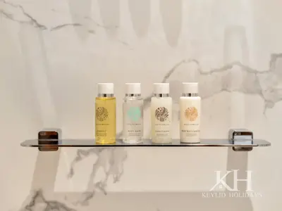 four bottles of hair products sitting on a shelf at keylid-2BR-Address Opera-5 mins walk to Dubai Mall in Dubai
