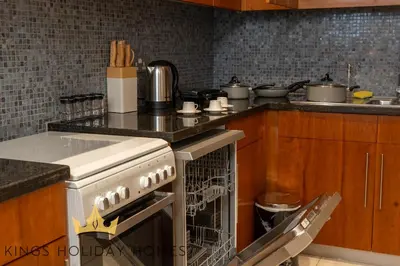 a kitchen with a stove and some pots and pans at Central Park towers residence difc in Dubai