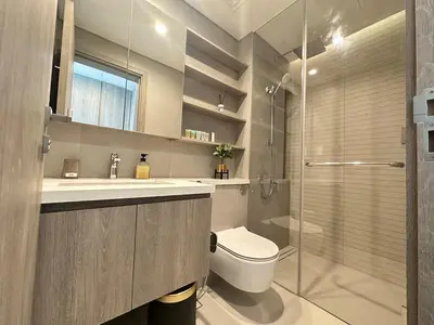 a bathroom with a toilet and a glass shower at Royal suite at Liv marina views in Dubai