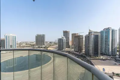 a view of the city from the top of a building at 2-Bedroom Haven with Canal View near The Els Club in Dubai