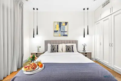 a bedroom with a bed with a bowl of fruit on it at Arabian Elegance 1BR Zanzabeel 1 Burj Khalifa View in Dubai