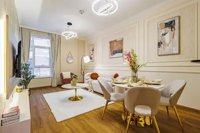 a dining room with a table and chairs and a living room at Elegant Oasis - 15 min to Burj Khalifa and Aiport - 1 BDR - 4 pax in Dubai