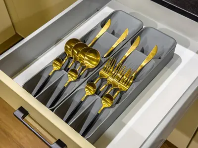 a tray of forks and knives in a drawer at Elegant Oasis - 15 min to Burj Khalifa and Aiport - 1 BDR - 4 pax in Dubai