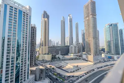 a view of a city with tall buildings and traffic at TRPS - MAG 318, Business Bay - Spacious Studio, Furnished, Close to Dubai Mall in Dubai