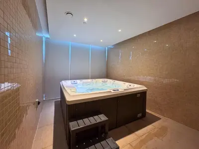 a bathroom with a jacuzzi tub in a room at Vogue Arjan Opalz by Danube near Science Park, One Bedroom Apartment with Balcony and Vibrant Community View, Access to all Amenitties in Dubai