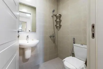 a bathroom with a toilet and a sink at Maison Privee - Chic & Eclectic Family Home with Park Vws in Meydan in Dubai