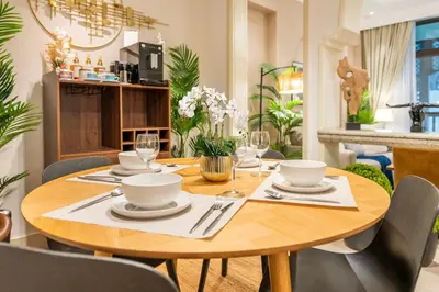a wooden table with chairs and a dining room at Charming 1 BR with Burj Khalifa View in Dubai