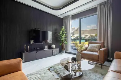 a living room with a couch and a tv at Frank Porter - J One Tower 2 in Dubai